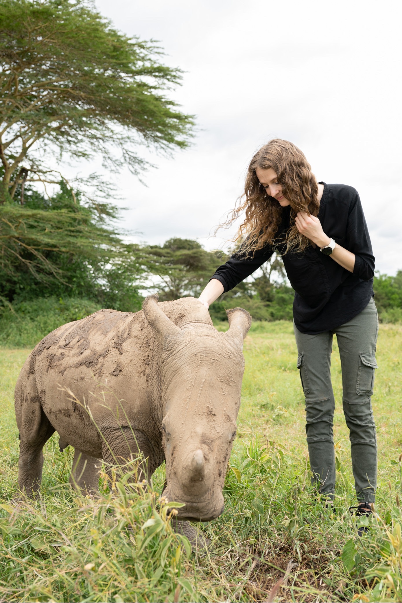Nadine Villabruna with Njamba, an orphaned baby rhino